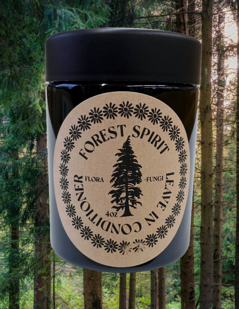 Jar of leave in conditioner labeled 'Forest Spirit' against a forest background