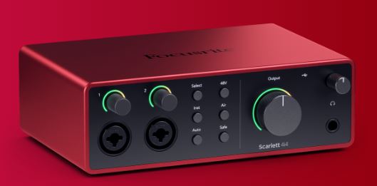 Red audio interface with control knobs on a red background